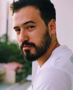 Confident attractive man looks at the camera